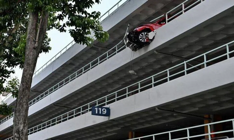 Volkswagen hangs 4 storeys above ground after crashing through wall at Bukit Merah carpark