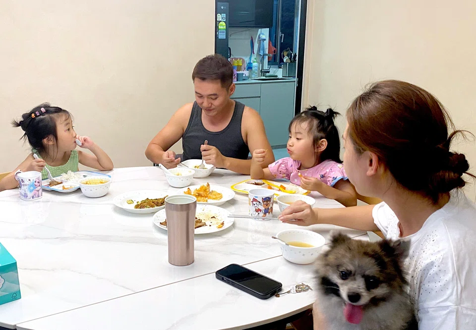 Mr Darren Tan tries to have dinner with his family every night, spending time with his two young daughters, before he goes back to work till about midnight.