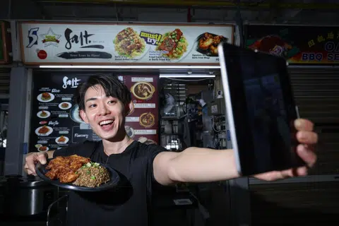 Salt's Kenny Ngoo generates content for his stall’s social media accounts. 