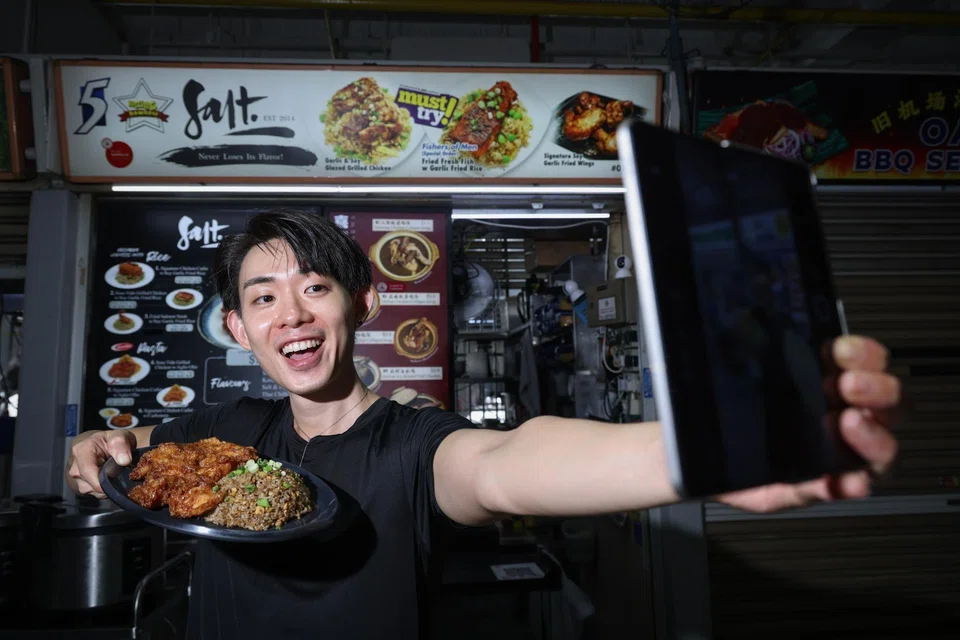 Salt's Kenny Ngoo generates content for his stall’s social media accounts. 