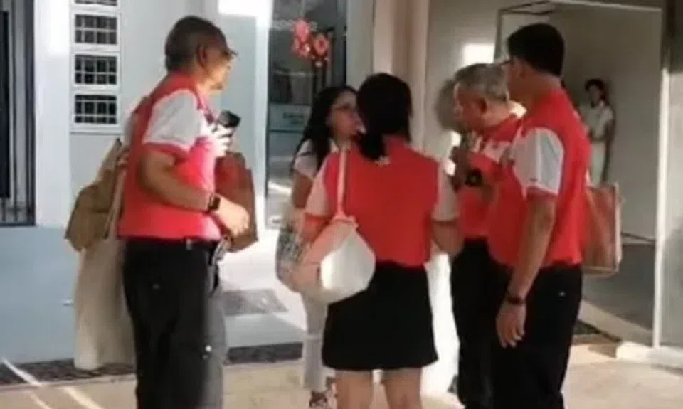 One of the videos released by Mr Azman Ibrahim shows a group of PSP members standing in a circle speaking to an unidentified female PAP volunteer.