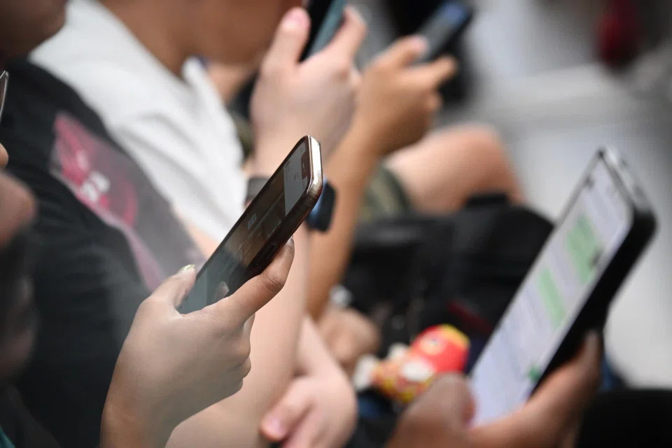 It is common to see commuters glued to their screens.
