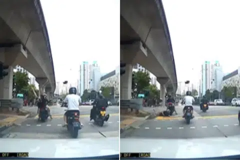 The passenger stands up shortly after the fall, appearing unharmed.