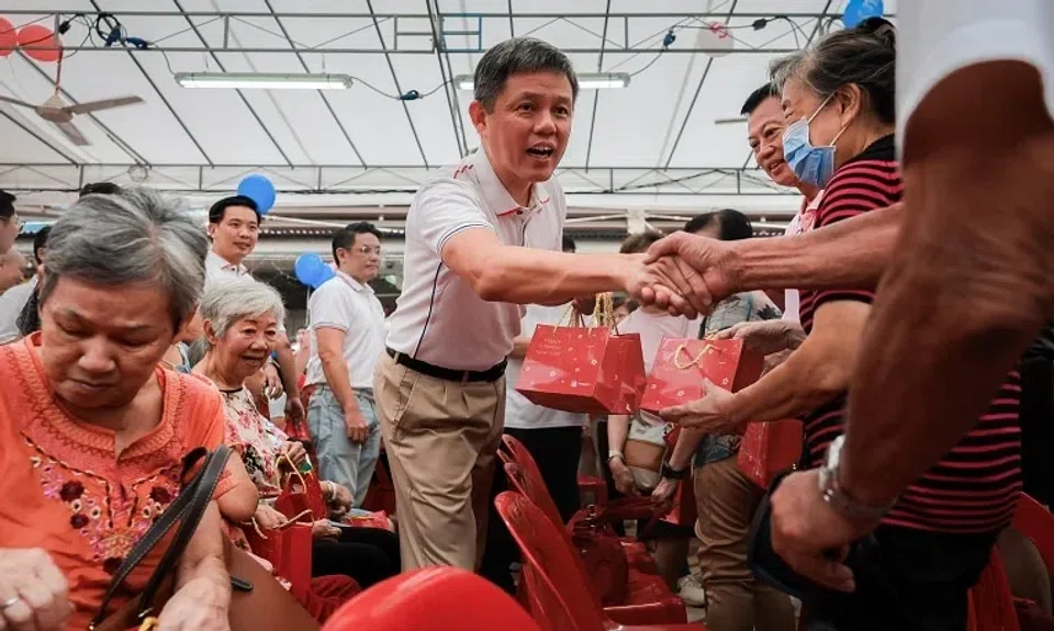 Education Minister Chan Chun Sing distributing oranges to residents at the launch of the new five-year plan for Tanjong Pagar on Feb 2. 