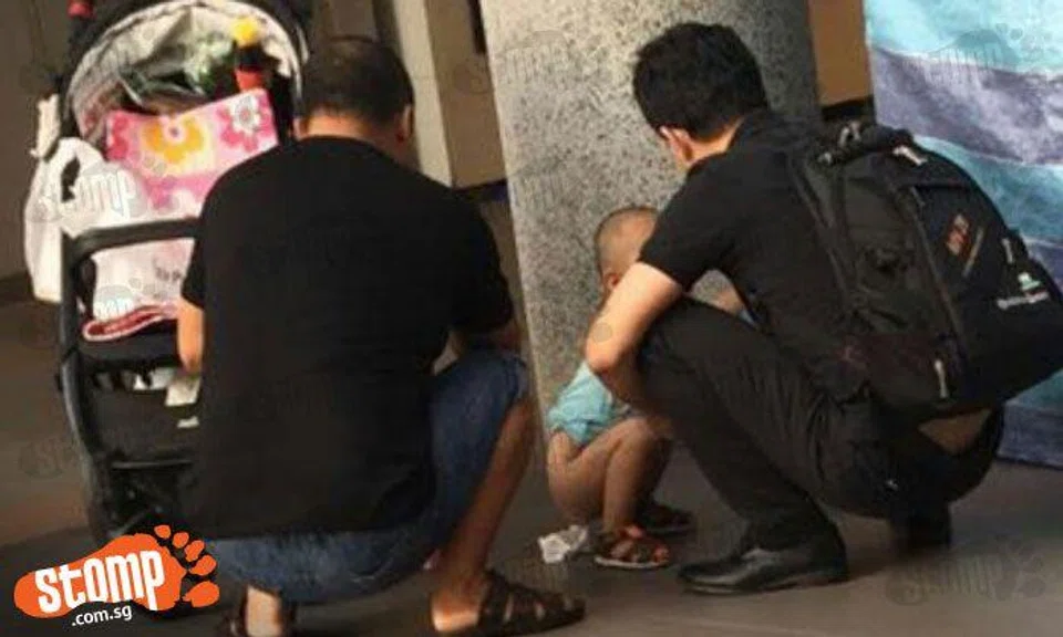 Gross! Men let toddler poop in public at Compassvale Link when there's a toilet nearby