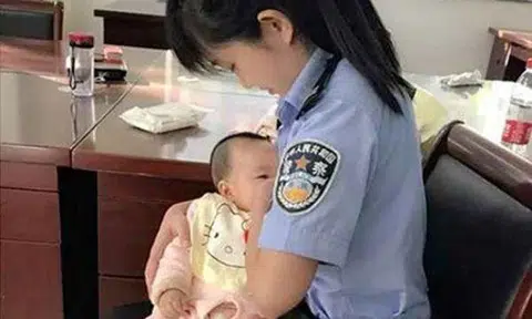 Photo of China's 'most beautiful bailiff' breastfeeding defendant's baby draws praise