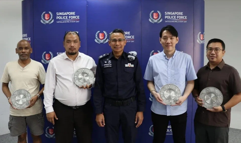 Commander TransCom with recipients of the Public Spiritedness Award.