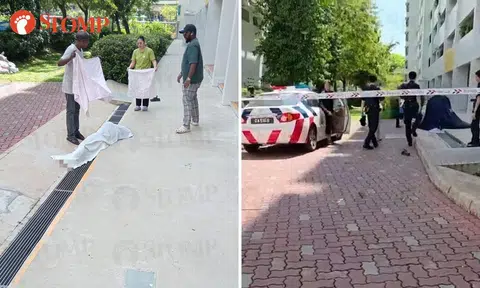 Residents cover 66-year-old woman's body after she's found dead at foot of Toa Payoh block