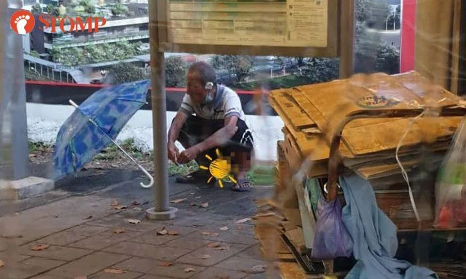 Man attends to 'urgent business' -- by squatting down to defecate at bus stop