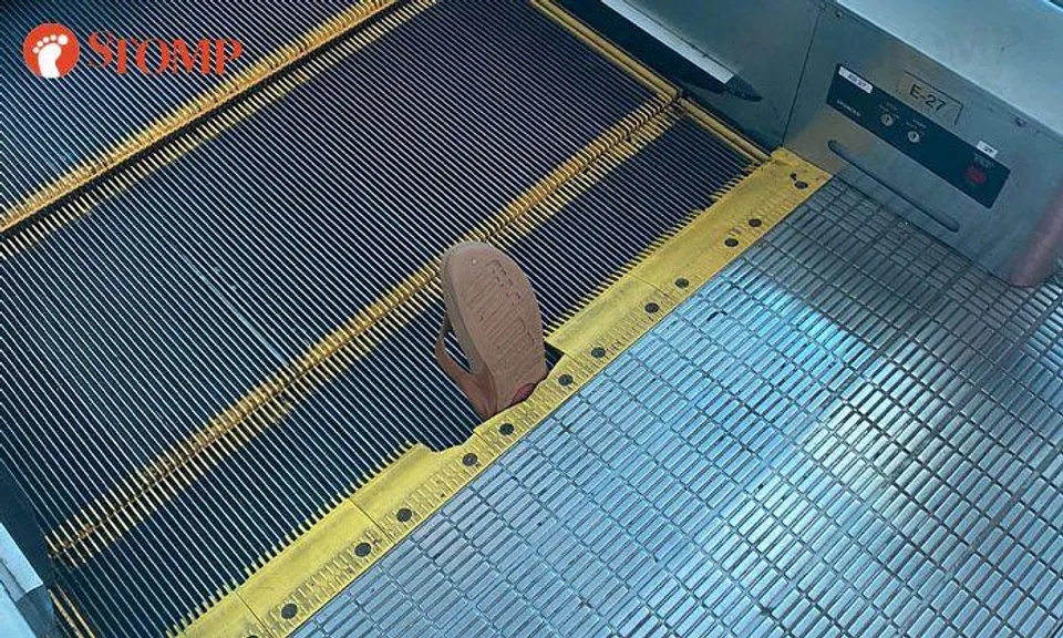 Woman falls down after slipper gets caught in escalator at Plaza Singapura