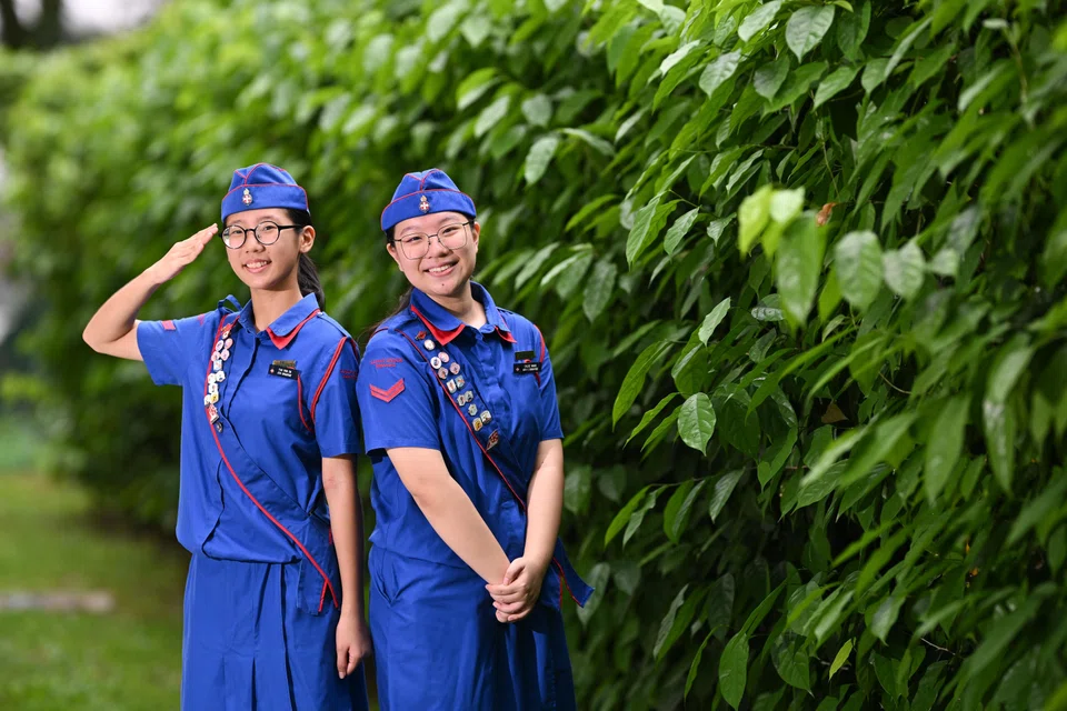 Corporal Pan Ying En (left), and Corporal Chloe Wang at The Girls' Brigade launch of the GB Friend in Deed Project 2025 at Jalan Kukoh on May 22.