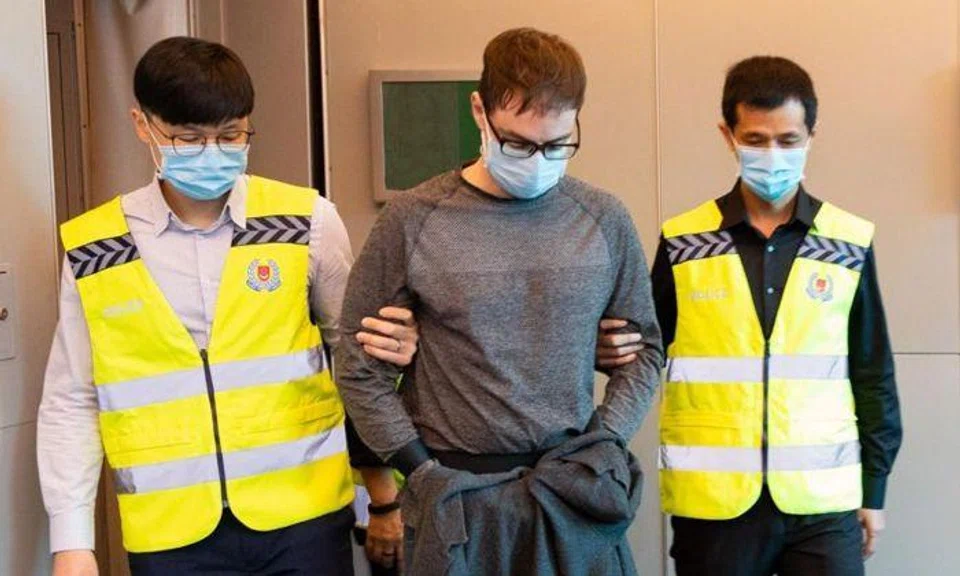 Canadian David James Roach arriving in Singapore on March 17 last year, after his extradition from Britain. PHOTO: SINGAPORE POLICE FORCE