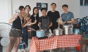Soup kitchen volunteers pose for a photo.