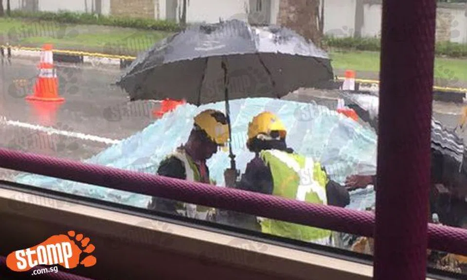 Should these poor guys still be working -- in the rain?