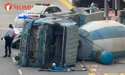 Cement truck overturns in Chinatown, driver taken to hospital
