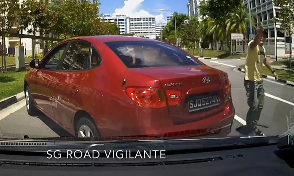 Man rages at driver and boxes his car in after causing collision