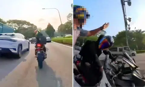 malaysia-registered motorcycle rider flashes finger while lane cutting, gets smack on helmet