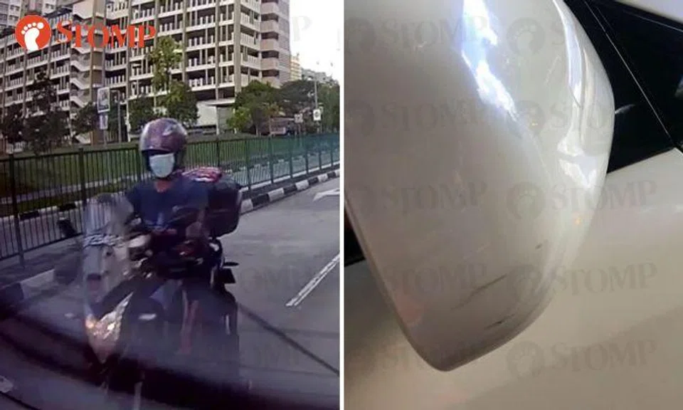 Motorcyclist allegedly hits driver's side mirror, but rides on 'as if nothing happened'