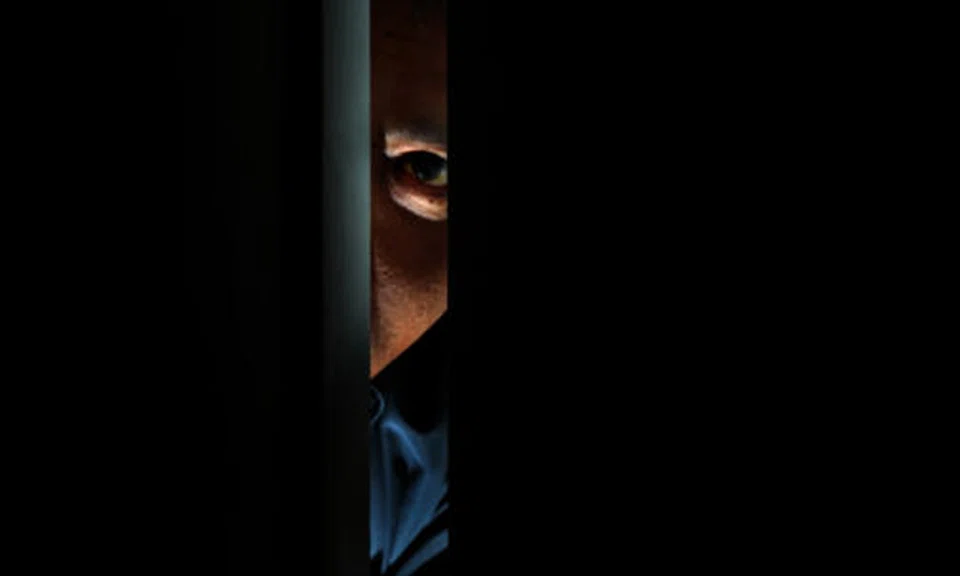 Man and woman charged for conducting surveillance on police officer without approval