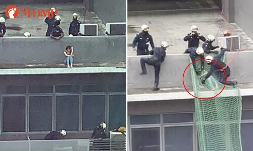 Watch: SCDF officers rescue woman sitting on ledge of Vertex building in Ubi