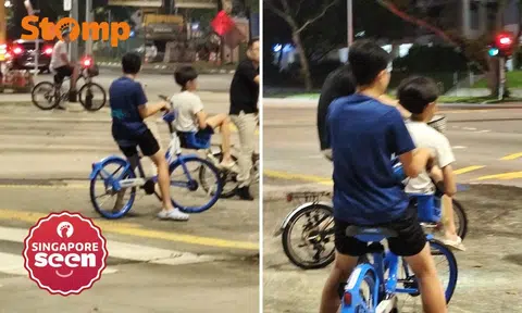 boy sits in basket of HelloRide bike