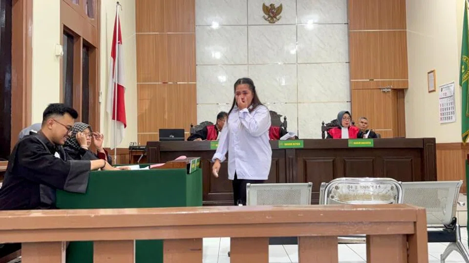 Alleged baby trafficking recruiter Astri Fitrininka cries after prosecutors seek a 10-year prison sentence for her at a hearing in Bandung, West Java on June 30.