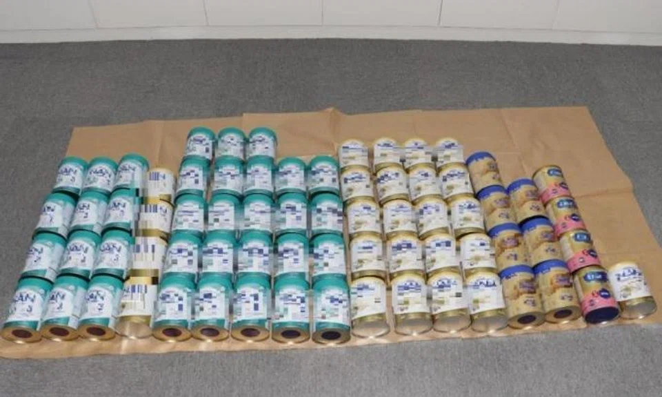 The police said 71 tins of milk powder worth about $4,000 were recovered.