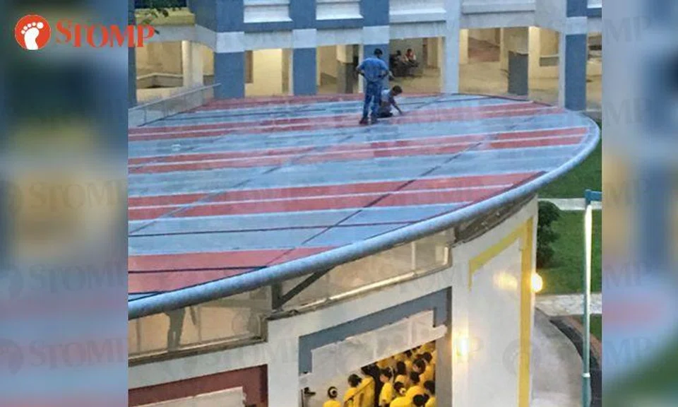 Stomper Raf came across three men walking on the rooftop of a multi-purpose hall at Woodlands Drive 16.