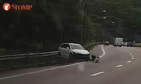 Car sent spinning after skidding and crashing into road barrier on PIE slip road