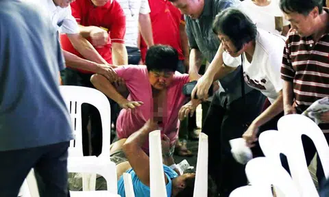 Auntie's face left bleeding from fight after removing spectator's chair during getai performance