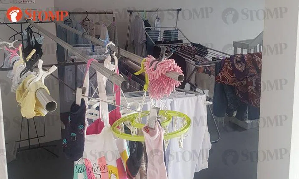 Resident advised to remove laundry at Anchorvale Link staircase by Town Council