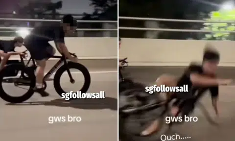 rider falls off bicycle and appears to to land on his head