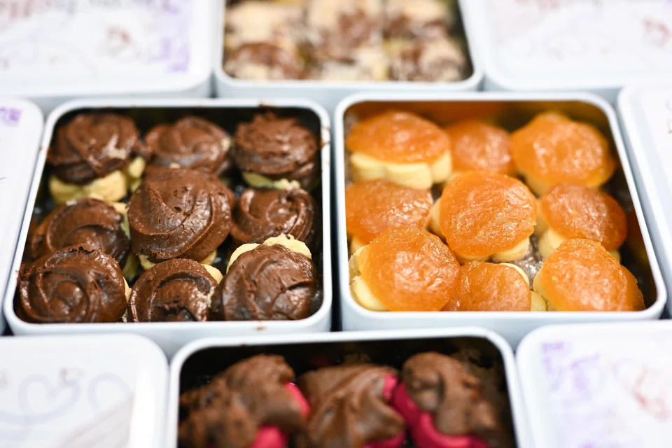 Ms Nur sells around 500 tins of her signature Frenchella tarts on TikTok Shop in an average week. Each tin has 23 pieces and costs from $23 a box. ST PHOTO: LIM YAOHUI