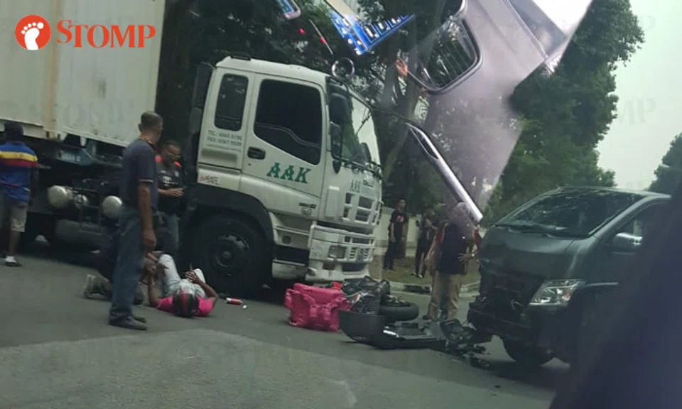 Delivery rider taken to hospital after accident with trailer truck and ...