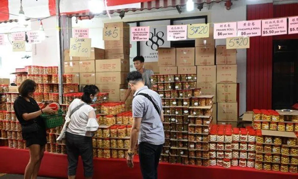 Snacks that used to retail for $10 a tub now go for $5. And if you are buying in bulk, $20 can get you five boxes of cookies that originally cost $6 each. Photo: The Straits Times