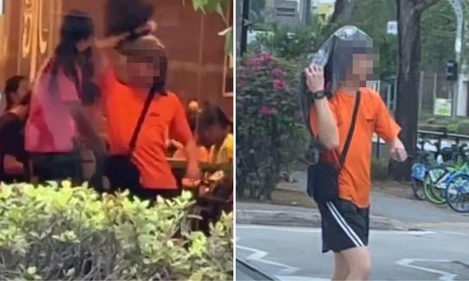 The man was dressed in a bright orange shirt and black shorts.