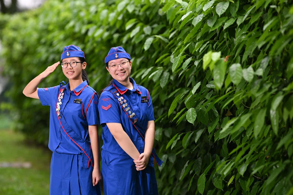 Corporal Pan Ying En (left), and Corporal Chloe Wang at The Girls' Brigade launch of the GB Friend in Deed Project 2025 at Jalan Kukoh on May 22.