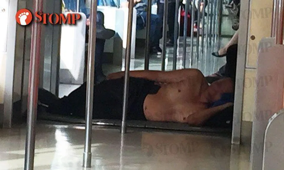 The weather's clearly too hot for uncle who lay topless in MRT train