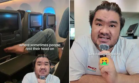 passenger rests bare feet on sia tray table