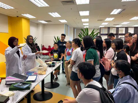 Visitors to the LSC in Changi on Sept 5 had a sneak peek into how books are processed and preserved, and how they make their way to the library shelves.