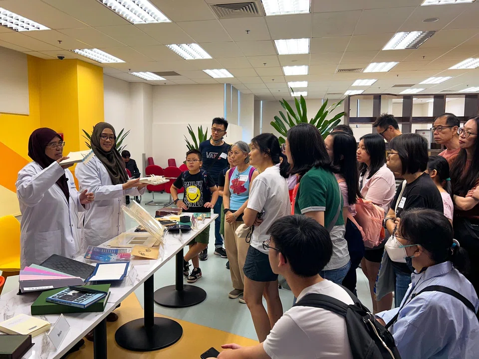 Visitors to the LSC in Changi on Sept 5 had a sneak peek into how books are processed and preserved, and how they make their way to the library shelves.