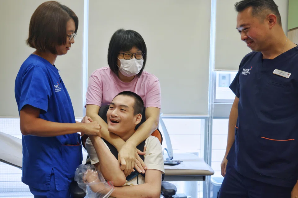 Mr Lucas Oon with (from left) assistant nurse clinician Kimberly Quek, his mother Vanessa Oon, and Dr Jeremy Lin. 