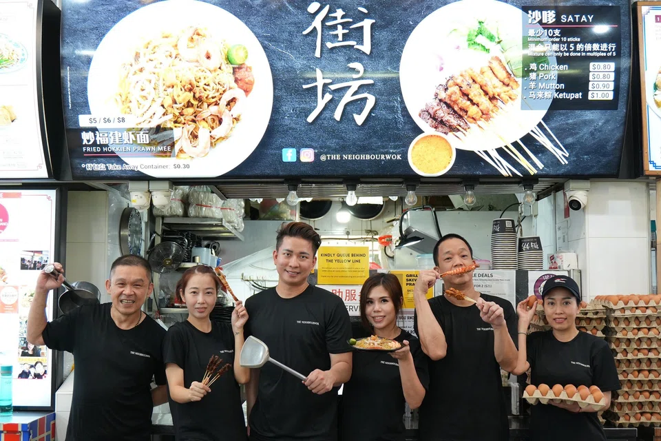 The Neighbourwok’s Kelvin Teo and Joreen Ong (third and fourth from left) with their staff (from left) Yap Kok Wai, Pham Thi Bich Tram, Lee Kim Foong and Pham Thi Kim Phung. 