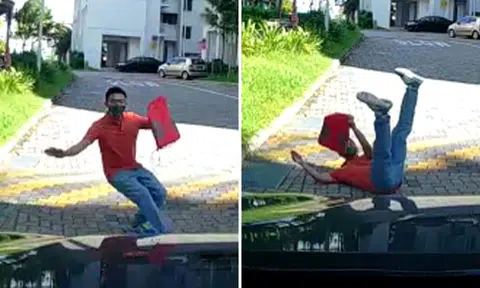 Pedestrian tumbles to the ground not once but twice -- even though car hasn't touched him