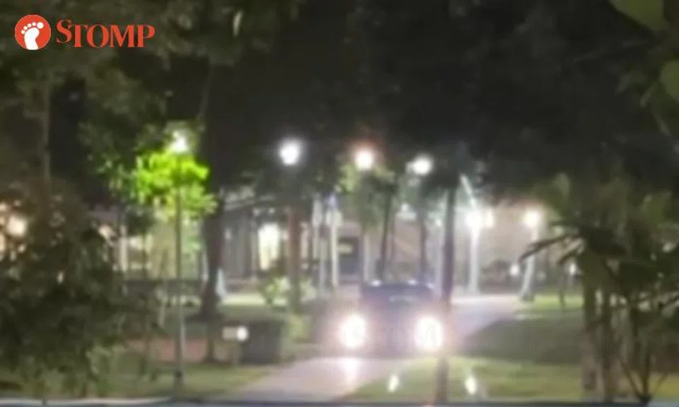 A car driver was seen driving down a pedestrian walkway near Block 129 Canberra Street.