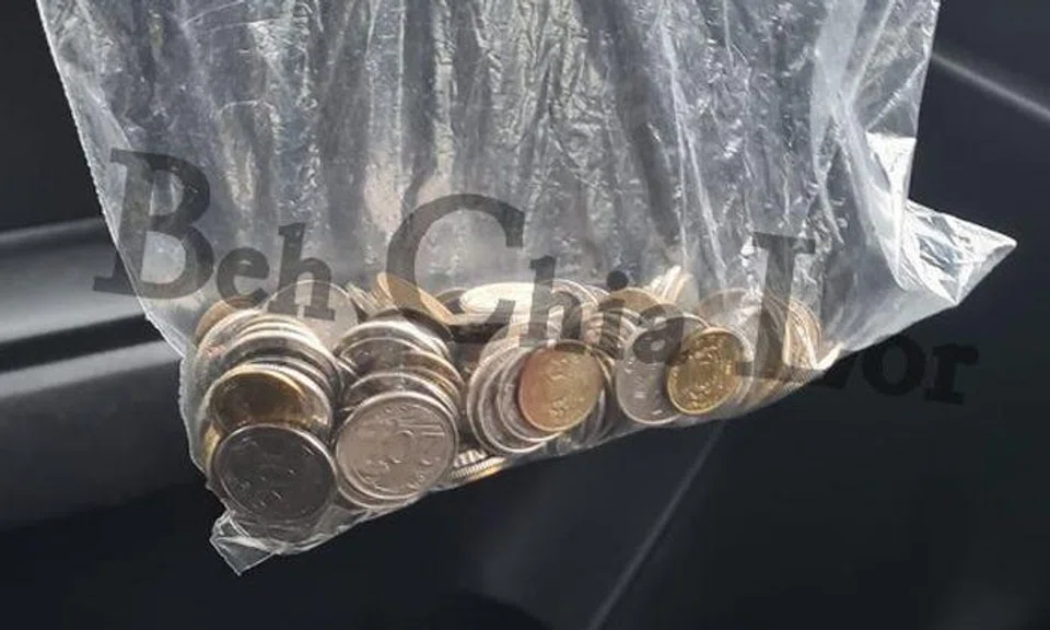 PHV passenger pays $19.30 fare -- with bag of coins