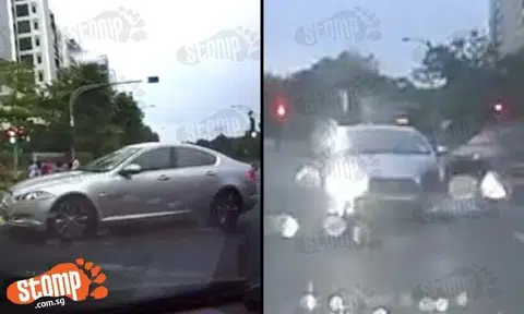 Why you high beam me? Impatient Jaguar driver forces his way through and shines headlights at Stomper