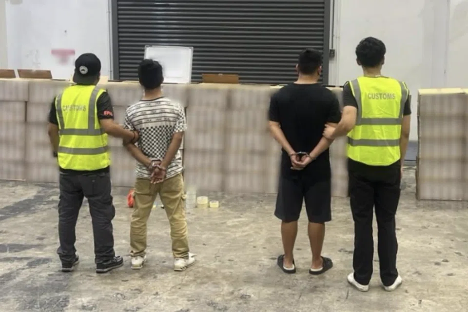 Two of the men arrested and the duty-unpaid cigarettes seized.