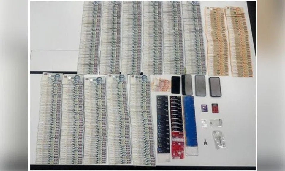 Cash amounting to more than $34,000, an assortment of bank ATM cards and mobile SIM cards, four mobile phones and an Internet banking token.