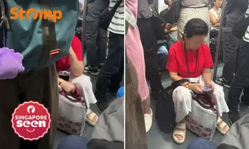 woman on stool in MRT train